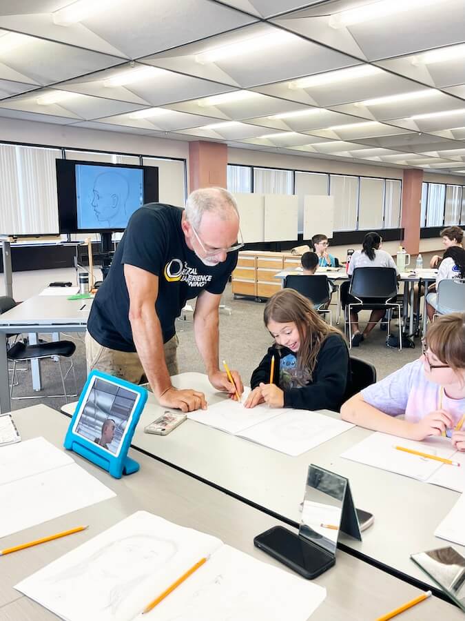 Teacher helping student